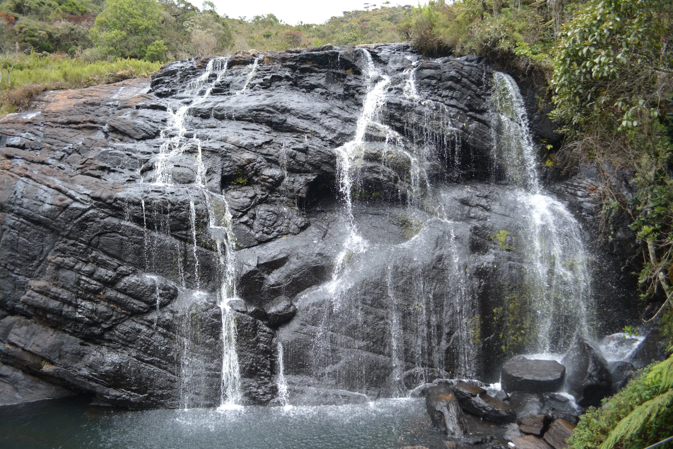 Baker's Falls spreading over black rock on the Horton Plains