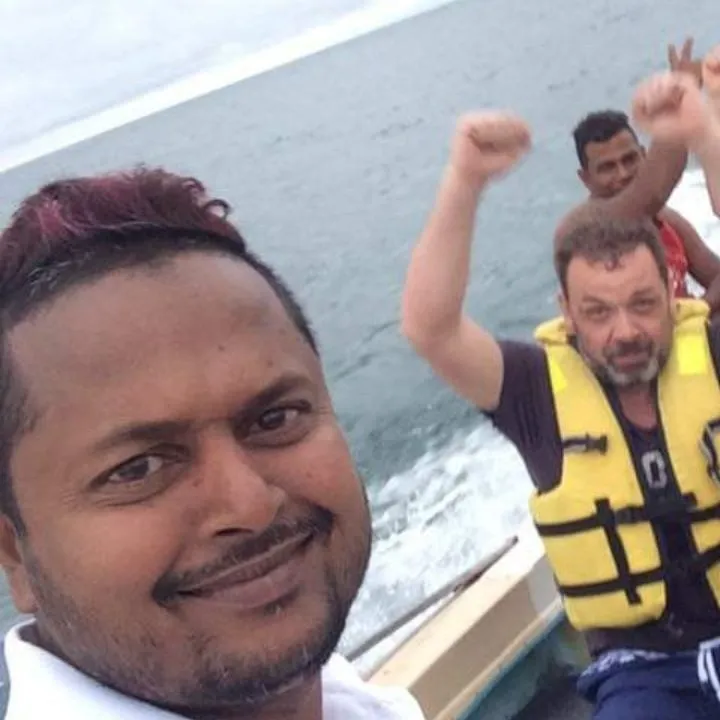 Kumar with guests on a boat trip